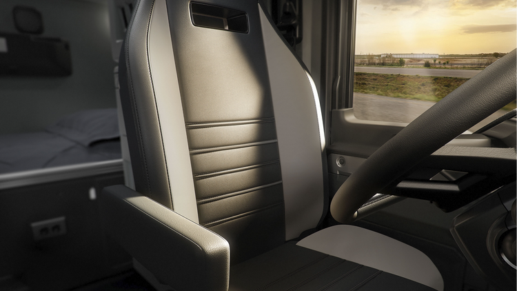 Interior view of a Mack truck showcasing a premium driver's seat