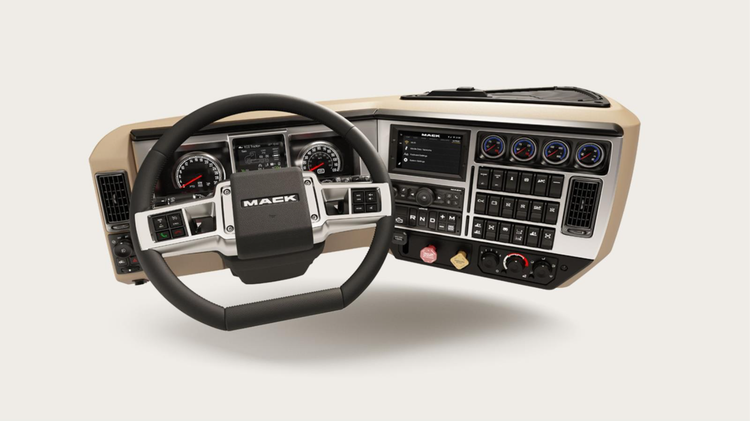 Mack truck wraparound dash featuring a D-shaped steering wheel, easy-to-reach controls, and a modern instrument cluster