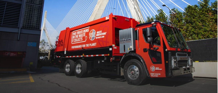 A red Mack MD Electric truck