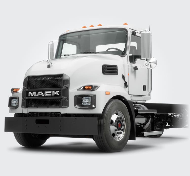 White Mack MD Series truck showcasing its durable front grille.
